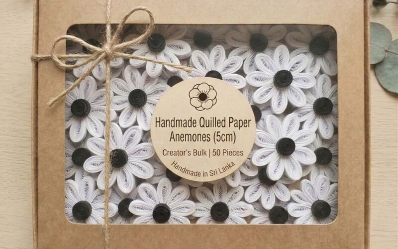 50 white paper quilling anemone flowers displayed in an open kraft gift box tied with twine by Dquills Sri Lanka